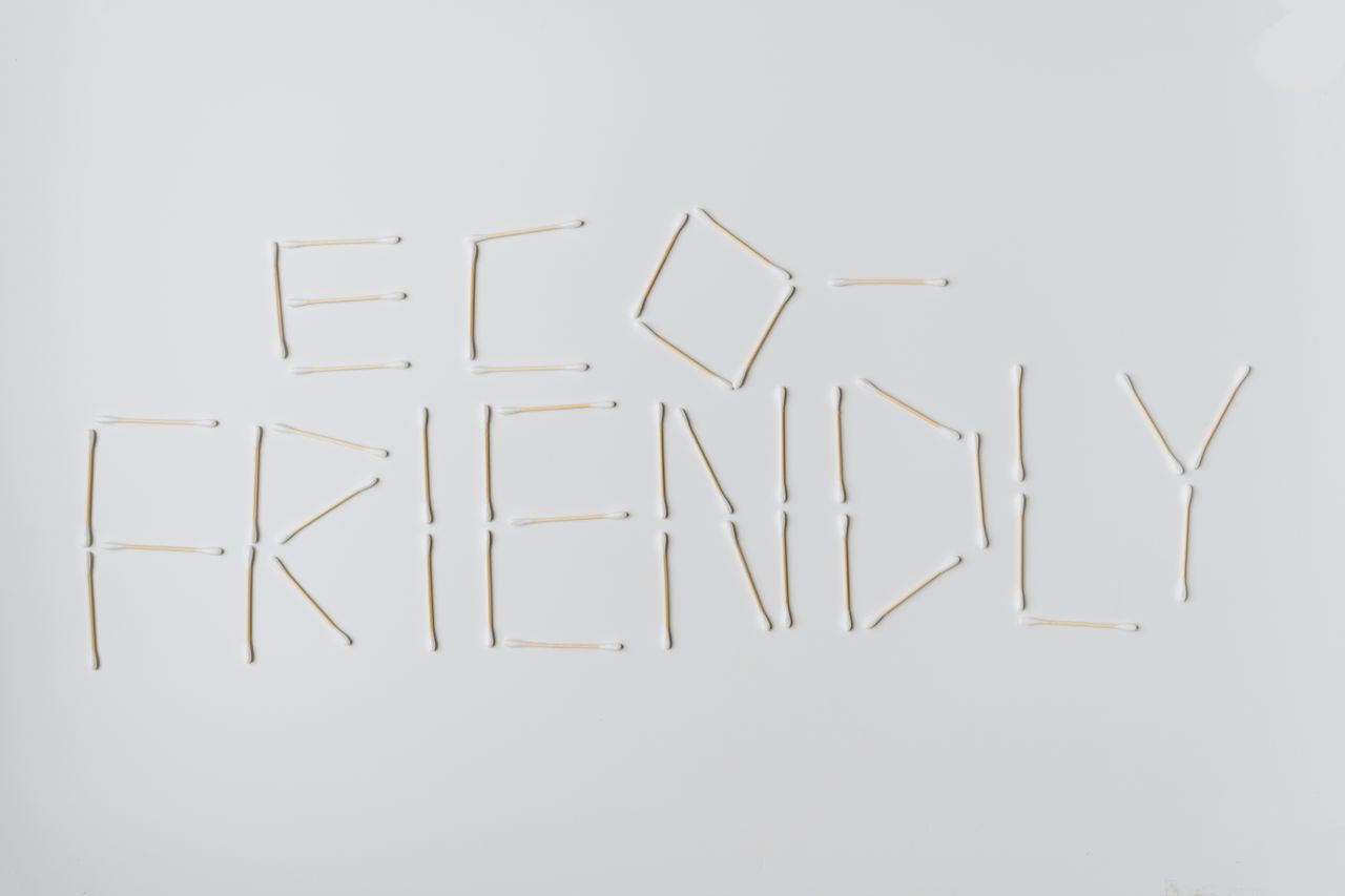 why-choose-us-03 Cotton swabs spelling out eco-friendly on a clean white surface.
